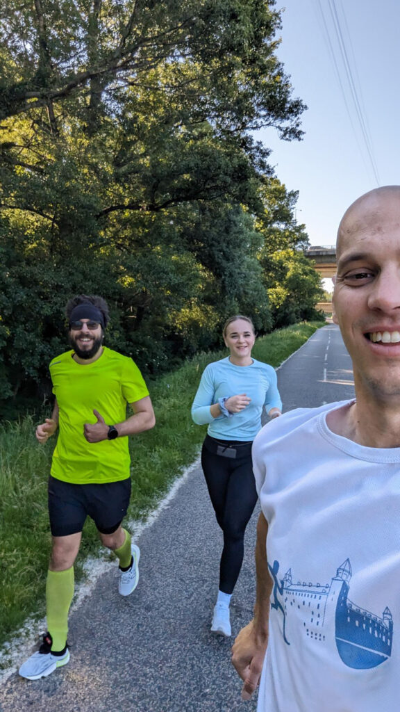 two men and one woman running