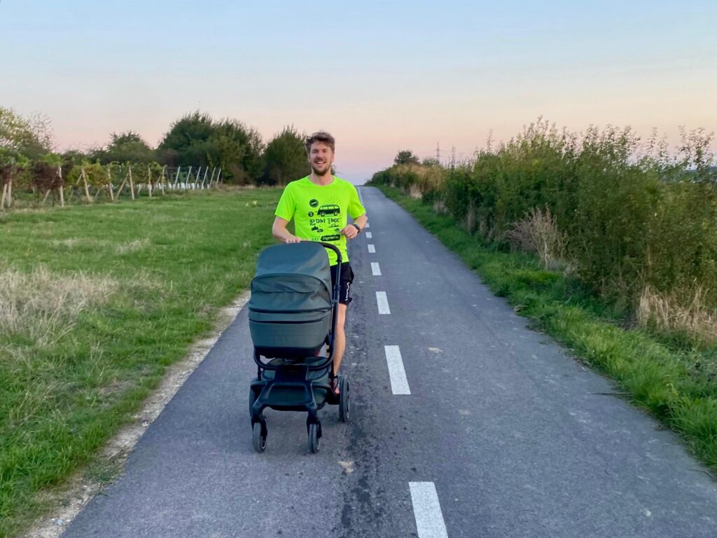 a man running with a stroller