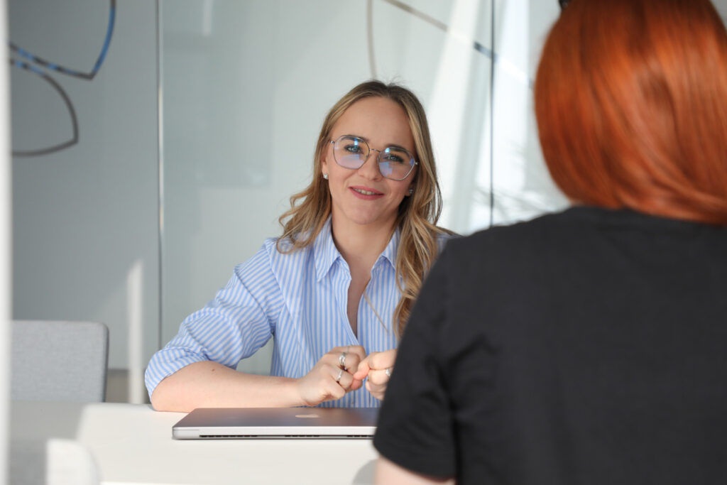 a detail of a female software engineer talking 